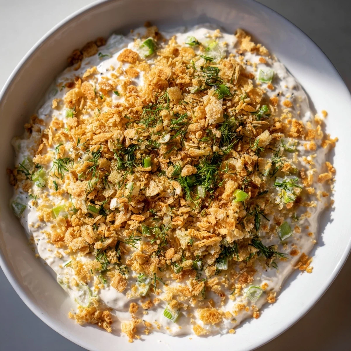 Enjoy a spoonful of Fried Pickle Dip with crunchy panko – a delicious party appetizer.