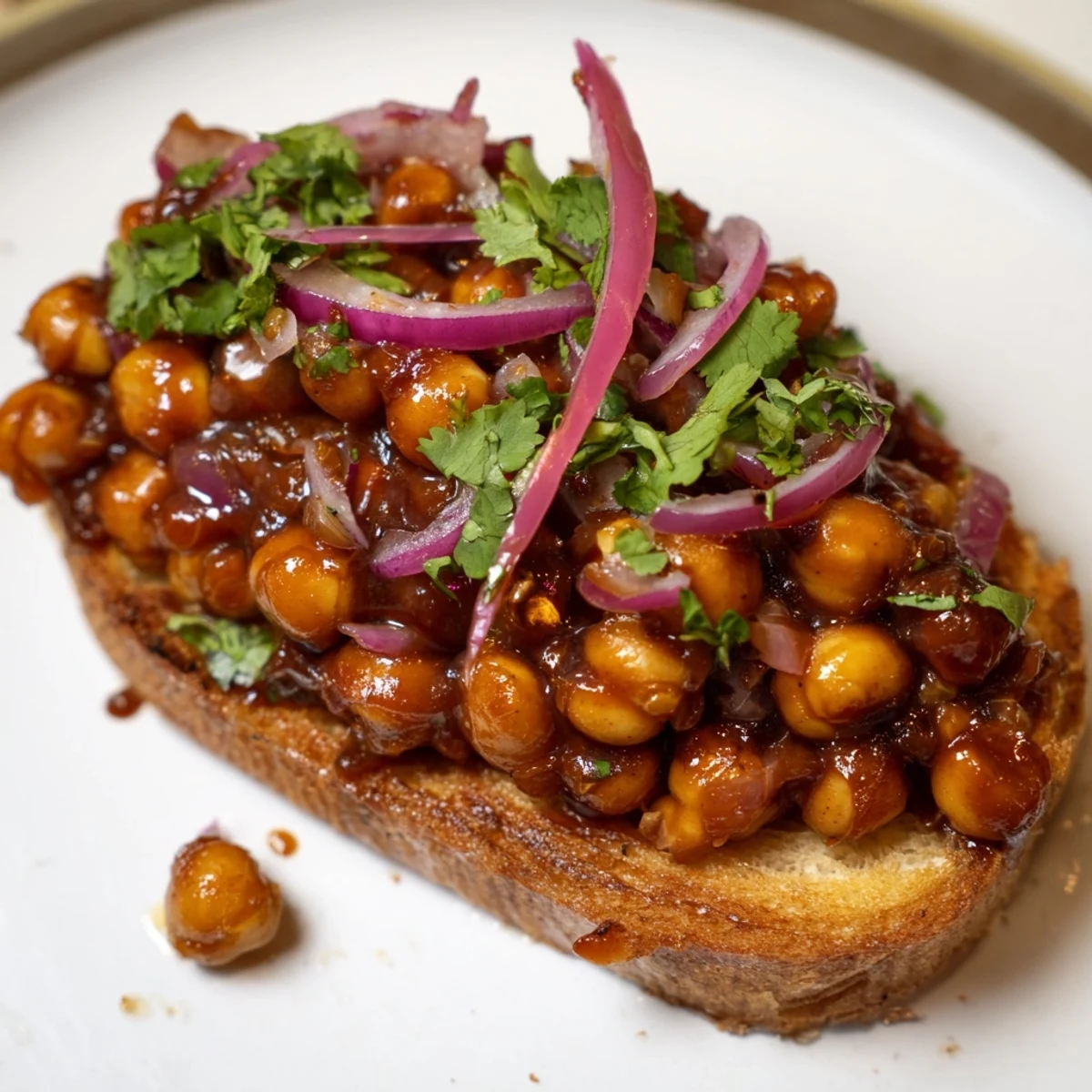 Golden, crispy toast topped with savory BBQ chickpeas, a delicious vegan lunch option.
