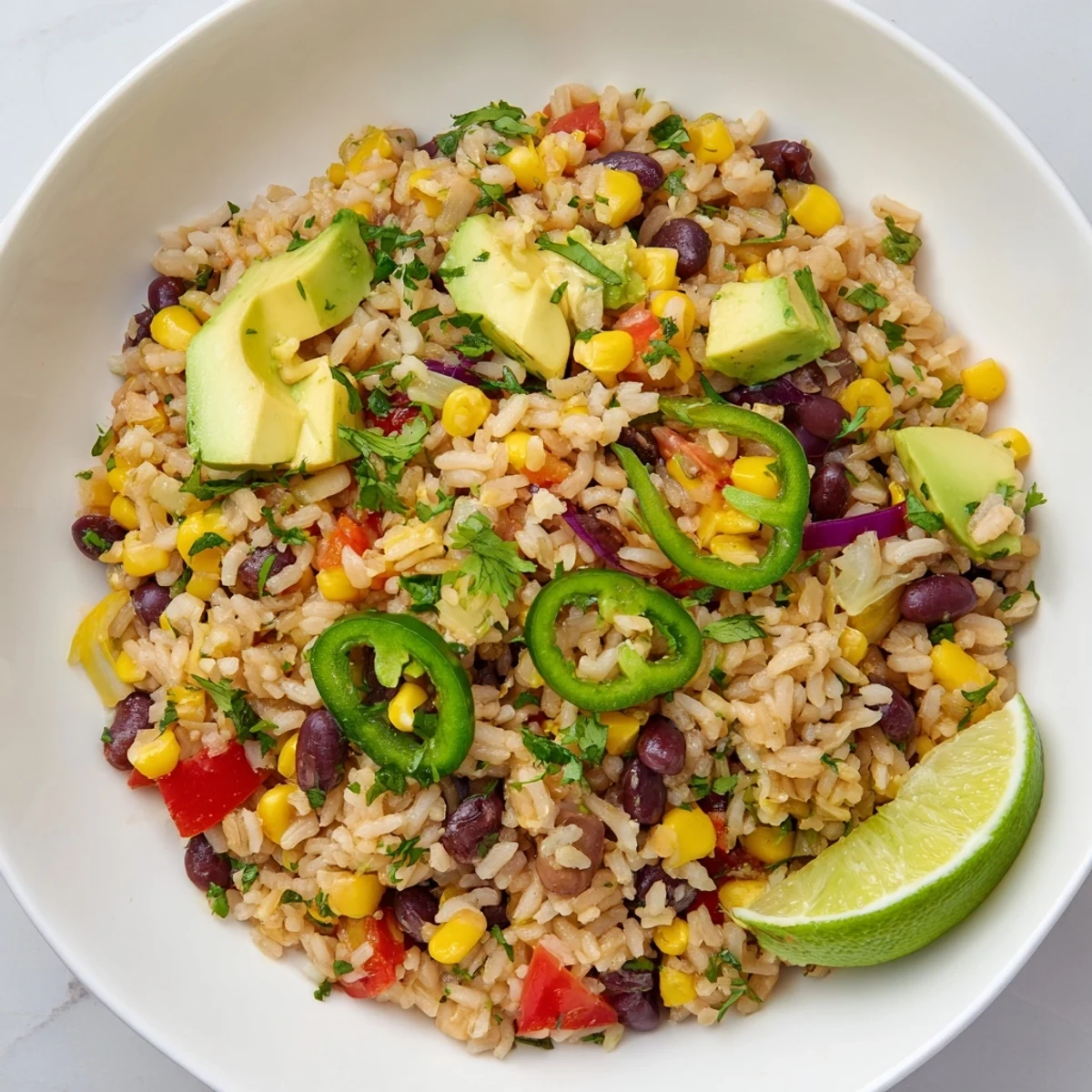 Steamy One-Pot Mexican Rice & Beans, a flavorful vegetarian main dish garnished with fresh cilantro and lime.