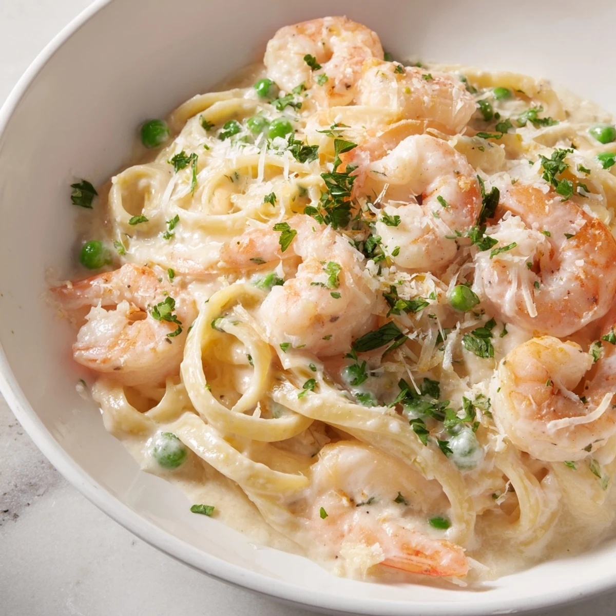 Steaming Instant Pot Shrimp Alfredo Pasta, a comforting weeknight meal with creamy sauce and shrimp.