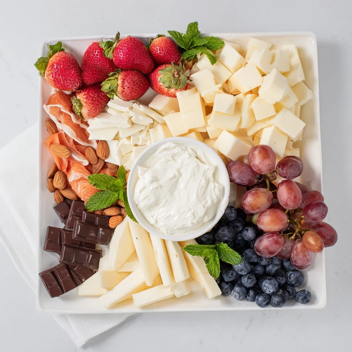 Imagine the flavors of this Gift Box Brunch Board Delight with honey, jam, and assorted fruits, beautifully presented.