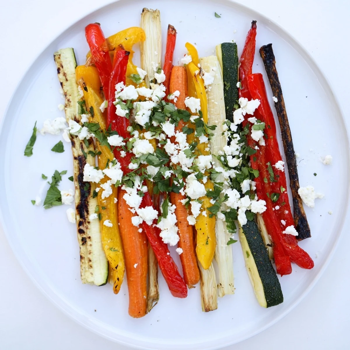Festive Christmas Sleigh Veggie Rails, with roasted carrots, bell peppers forming a delicious vegetarian appetizer.