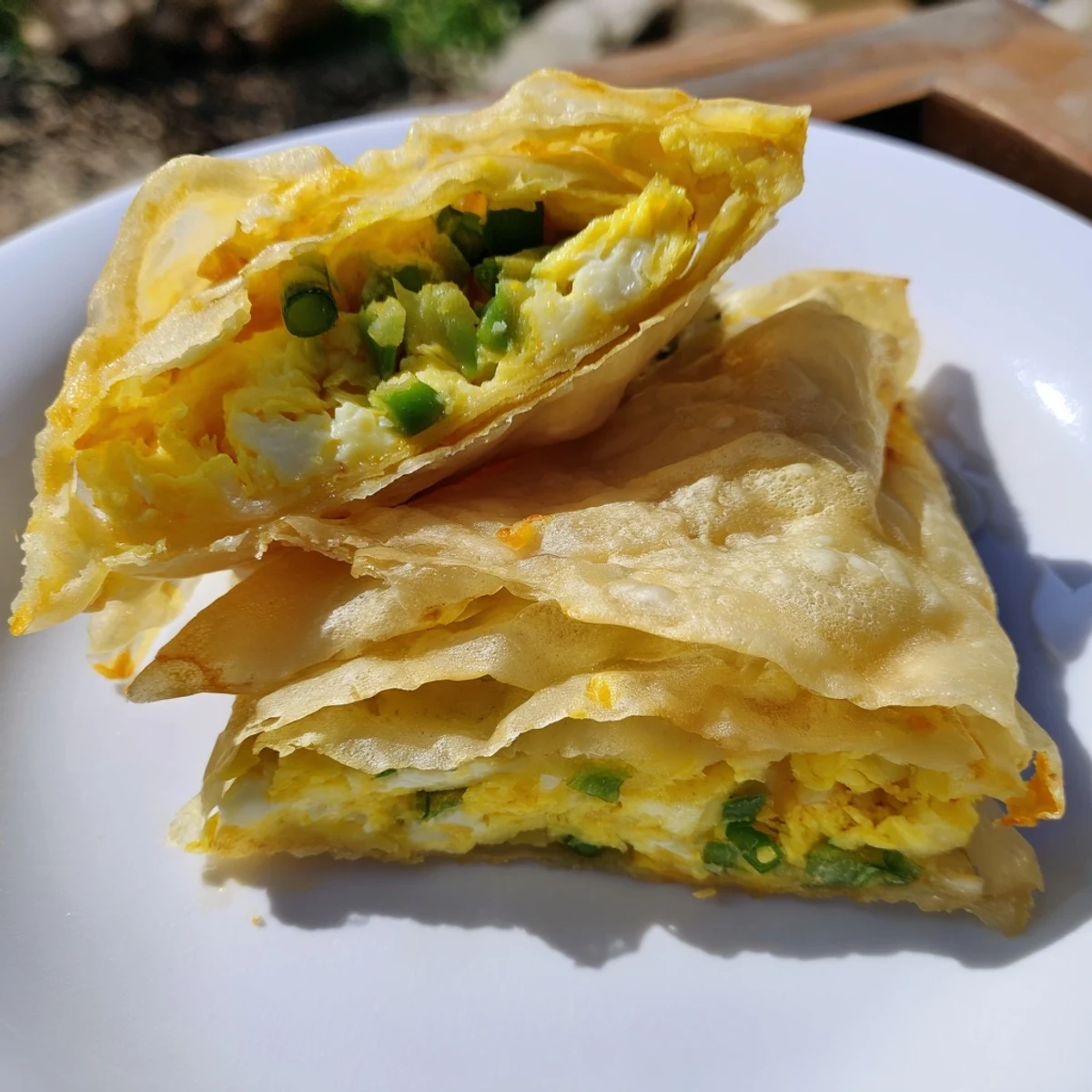 Warm, savory image of a prepared Rice Paper Egg & Cheese Fold, ready to be sliced and served.