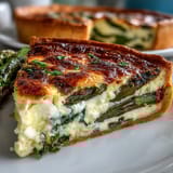 Elegant asparagus and Brie quiche, perfect for a festive spring brunch or special occasion.  