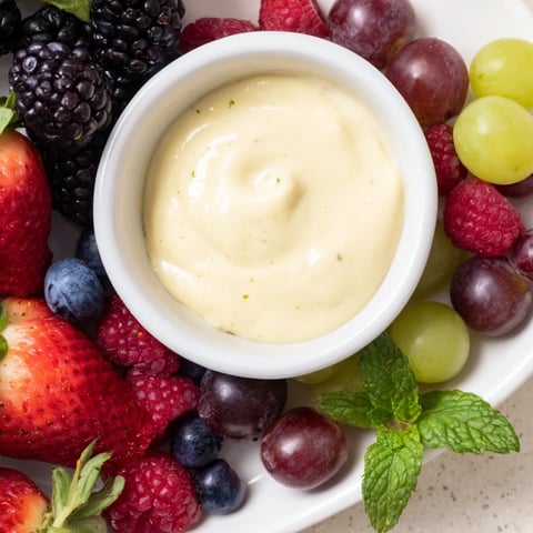 Festive Mistletoe Kiss Berry Dip Board: a beautiful display of fresh berries surrounding creamy, chilled dip.