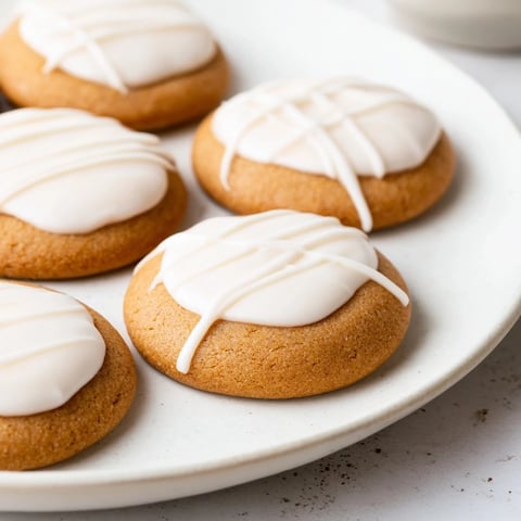 Golden brown Holiday Cookies with Icing Drizzle, drizzled beautifully for a delightful holiday dessert.
