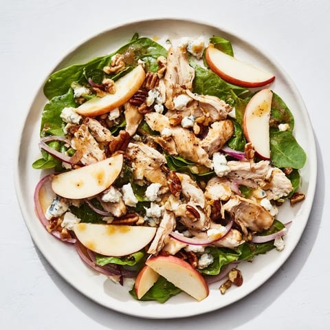 Chicken and Apple Winter Salad, a colorful mix of apples, chicken, and pecans, looks refreshingly delicious.