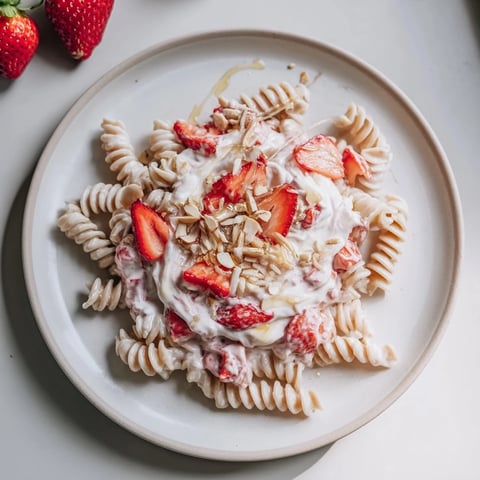 Sweet Strawberry Yogurt Pasta, a colorful pasta salad with fresh strawberries and creamy yogurt.