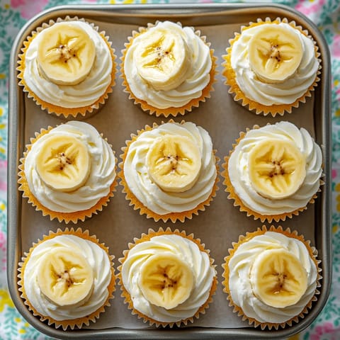 Banana cupcakes on a tray.