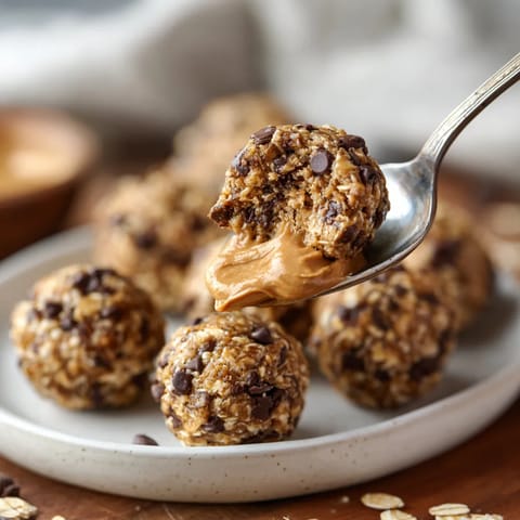 A spoonful of peanut butter on a plate.