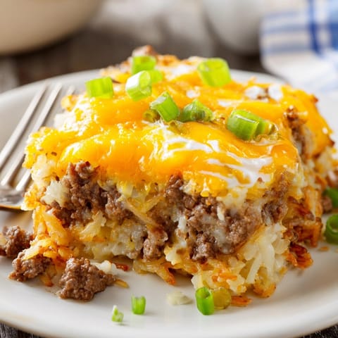 Creamy Cheeseburger Hash Brown Casserole, a comforting layer of beef, cheese, and potatoes.