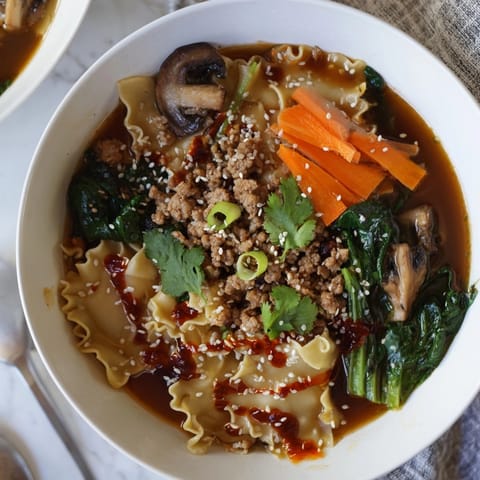 A hearty bowl of Spicy Ramen-Inspired Lasagne Soup, ready to be devoured.