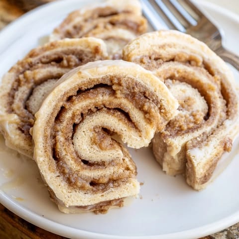 Delicious and warm Peanut Butter Cinnamon Roll Cookies sprinkled with cinnamon sugar and butter.  