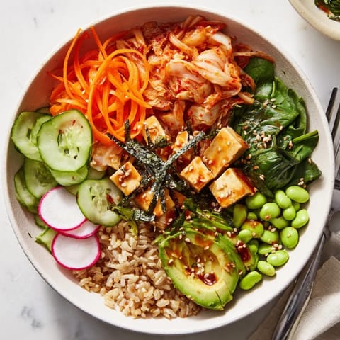 Hearty Fermented Vegetable Bowl featuring grains, avocado, and zesty homemade dressing.  