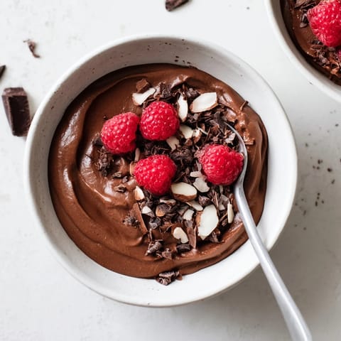 A decadent close-up shows the rich, dark No-Bake Cottage Cheese Chocolate Mousse, swirled to perfection.