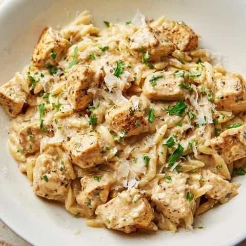 Golden chicken pieces and creamy Cajun Alfredo sauce coat the orzo in this one-pot meal.