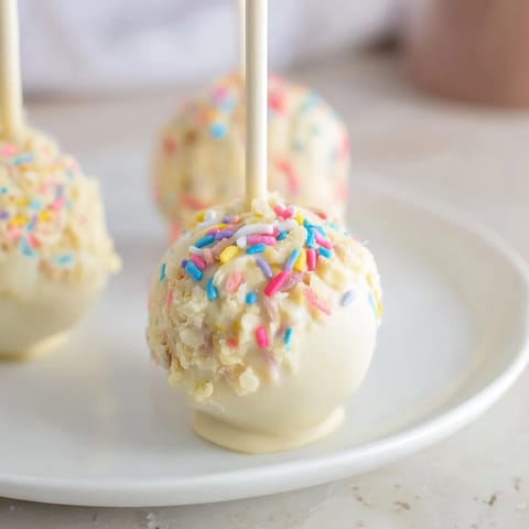 Bite into the delightful Lightened-Up Sugar Cookie Cake Pops, a guilt-free dessert option.