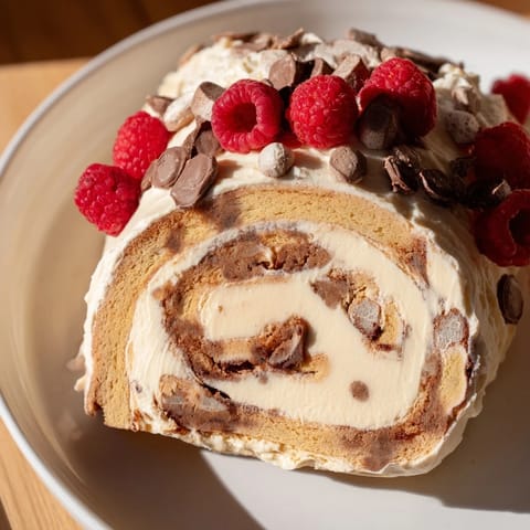 A delightful North Pole Cinnamon Roll Board is filled with warm, frosted rolls and colorful holiday garnishes.