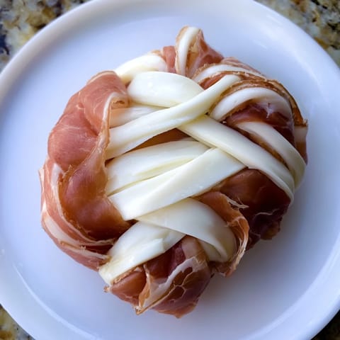Braided Nautical Knot, a visually stunning appetizer ready to eat, served on a white plate.