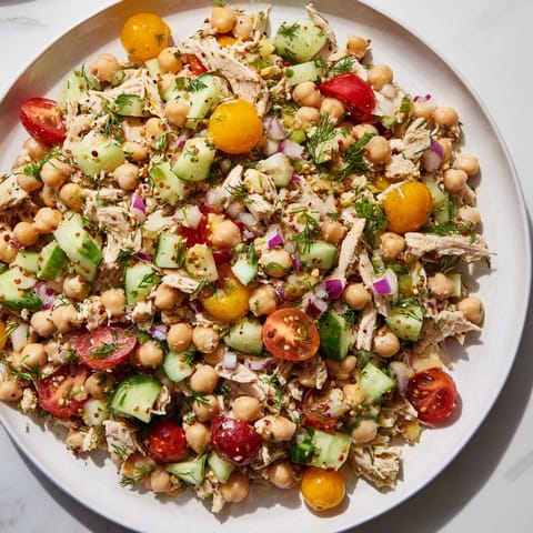 Bright, colorful Dense Bean Salad with Lemon-Dill Chicken, drizzled with zesty dressing, ready to enjoy.