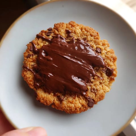 Golden-brown Air-Fryer Chocolate Chip Cookies, fresh from the air fryer, with melty chocolate chips.