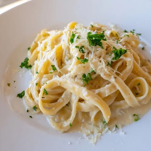 A close-up view of Sriracha Honey Pasta; the steam rises to show off its spicy, savory aroma.