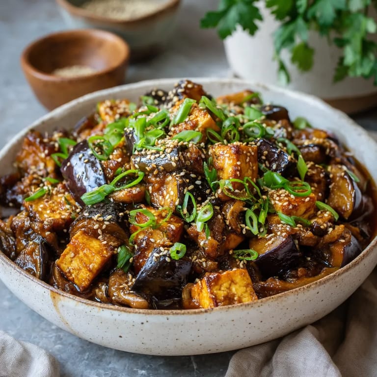 A bowl of food with a spoon in it.